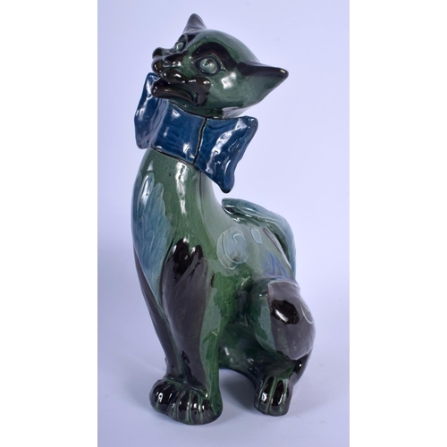 68 - A VINTAGE CHARLES BRANNAM POTTERY FIGURE OF A CAT modelled in a bowtie. 27 cm x 9 cm.