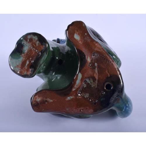 68 - A VINTAGE CHARLES BRANNAM POTTERY FIGURE OF A CAT modelled in a bowtie. 27 cm x 9 cm.