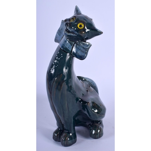 69 - A SMALLER VINTAGE CHARLES BRANNAM POTTERY FIGURE OF A CAT modelled in a bowtie. 21 cm x 7 cm.