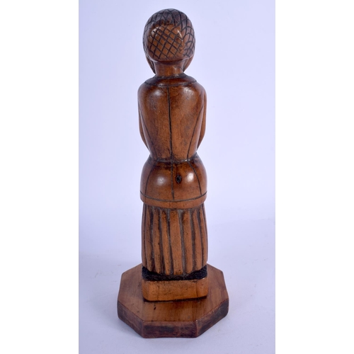 704 - AN 18TH CENTURY EUROPEAN CARVED FRUITWOOD FOLK ART TREEN FIGURE. 19 cm high.