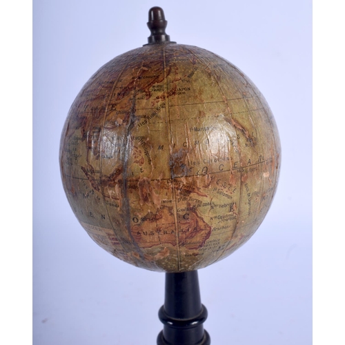 716 - A RARE 19TH CENTURY MAISON FOREST GLOBE TERRESTRE upon an ebonised base. 16 cm x 7 cm.