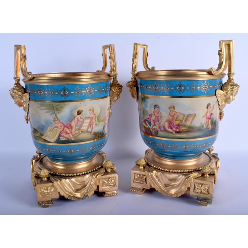 723 - A PAIR OF CONTEMPORARY SEVRES STYLE TWIN HANDLED PORCELAIN CACHE POTS decorated with putti. 33 cm x ... 