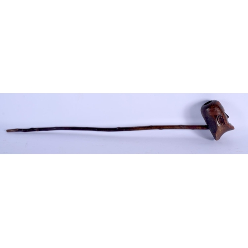 725 - AN ANTIQUE FOLK ART CARVED WOOD PIPE possibly tribal. . 58 cm long.