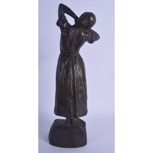 738 - AN ART NOUVEAU EUROPEAN BRONZE FIGURE OF A FEMALE modelled upon a stepped base. 30 cm high.