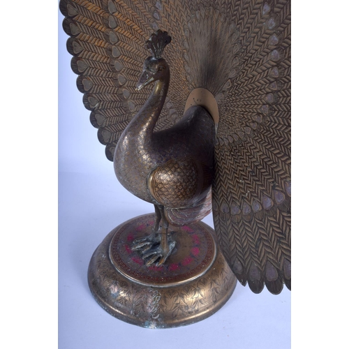 739 - A RARE LARGE PAIR OF EARLY 20TH CENTURY INDIAN ENAMELLED BRASS PEACOCKS upon circular bases decorate... 