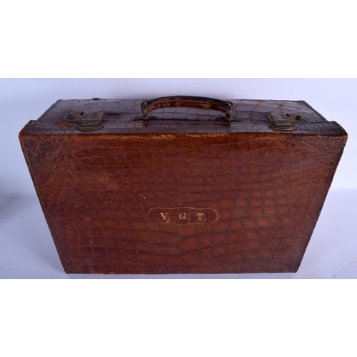 741 - AN ANTIQUE CROCODILE SKIN CASE. 48 cm x 32 cm x 22 cm.