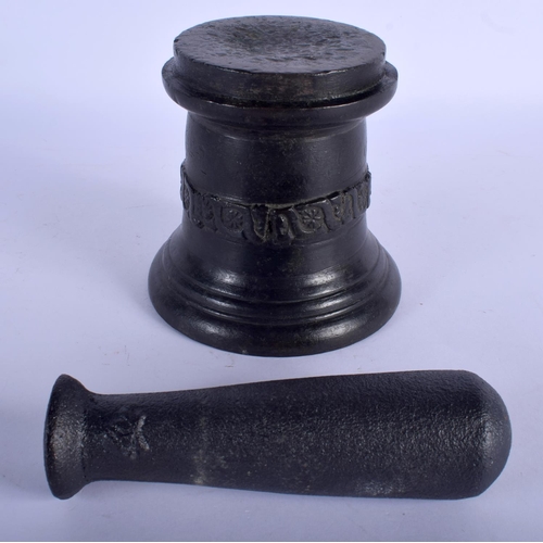 742 - AN ANTIQUE CAST IRON PESTLE AND MORTAR. 12 cm x 10 cm. (2)