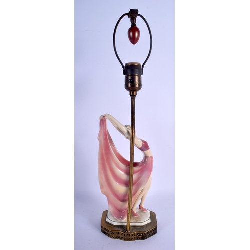 746 - AN ART DECO PORCELAIN FIGURE OF A DANCING GIRL converted to a lamp. Porcelain 27 cm x 10 cm.