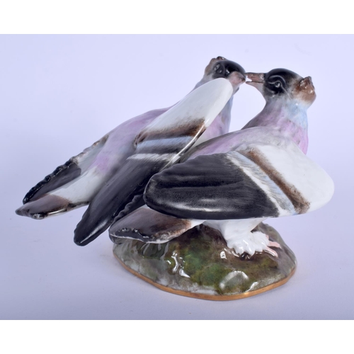 77 - A 19TH CENTURY MEISSEN PORCELAIN FIGURE OF PIGEON modelled upon a naturalistic outcrop. 14 cm x 10 c... 