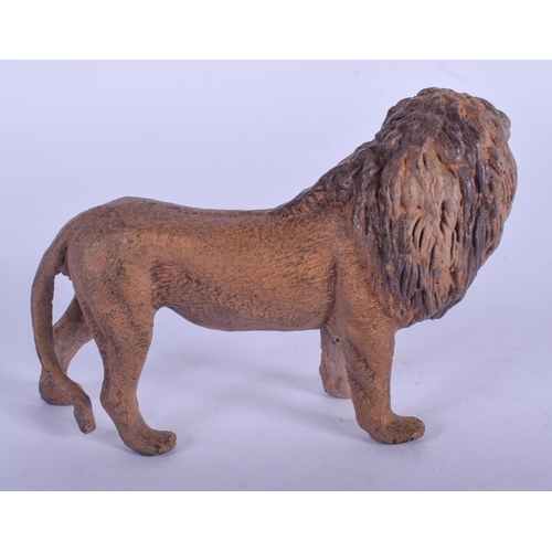 793 - A CONTEMPORARY COLD PAINTED BRONZE LION. 9 cm x 6 cm.