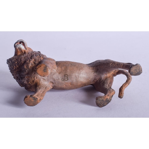 793 - A CONTEMPORARY COLD PAINTED BRONZE LION. 9 cm x 6 cm.