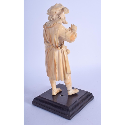 796 - A MID 19TH CENTURY EUROPEAN CARVED DIEPPE IVORY FIGURE OF A CAVALIER modelled roaming holding bottle... 