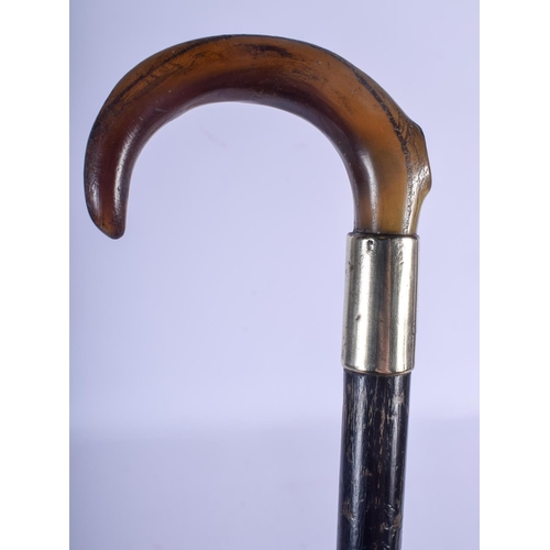 799 - A 19TH CENTURY CONTINENTAL CARVED RHINOCEROS HORN HANDLED SWAGGER STICK. 80 cm long.