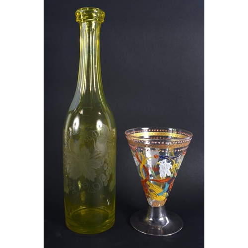 8 - A VINTAGE YELLOW GLASS ENGRAVED DECANTER together with an early silver mounted European glass goblet... 