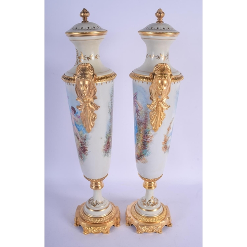 804 - A LARGE PAIR OF CONTEMPORARY CONTINENTAL PORCELAIN VASES AND COVERS Sevres Style. 50 cm high.