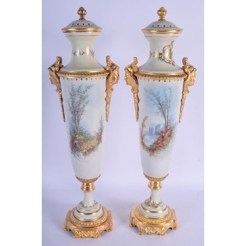 804 - A LARGE PAIR OF CONTEMPORARY CONTINENTAL PORCELAIN VASES AND COVERS Sevres Style. 50 cm high.