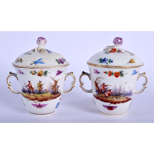 82 - A PAIR OF 19TH CENTURY KPM PORCELAIN TWIN HANDLED TREMBLEUSE CUPS AND SAUCERS painted with animals a... 