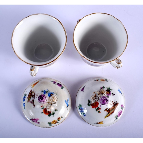 82 - A PAIR OF 19TH CENTURY KPM PORCELAIN TWIN HANDLED TREMBLEUSE CUPS AND SAUCERS painted with animals a... 