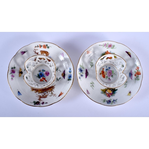 82 - A PAIR OF 19TH CENTURY KPM PORCELAIN TWIN HANDLED TREMBLEUSE CUPS AND SAUCERS painted with animals a... 