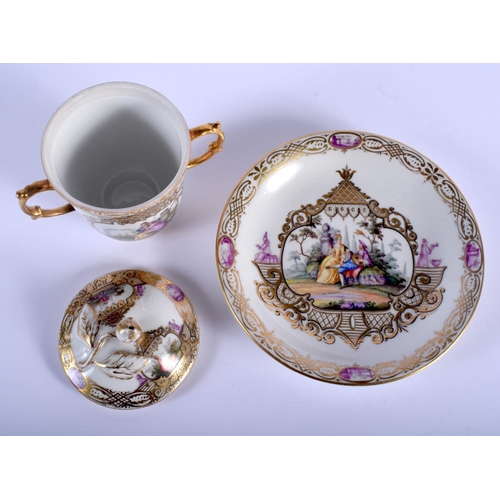 83 - A 19TH CENTURY MEISSEN AUGUSTUS REX PORCELAIN TWIN HANDLED CUP AND SAUCER painted with panels of fig... 