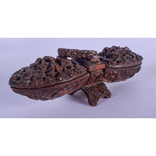 836 - AN EARLY 19TH CENTURY FRENCH CARVED COQUILLA NUT DOUBLE BO decorated with vines and foliage. 14 cm w... 