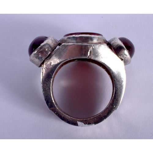 854 - A VINTAGE MIDDLE EASTERN SILVER AND AGATE KUFIC SCRIPT RING. V/W. 21 grams.