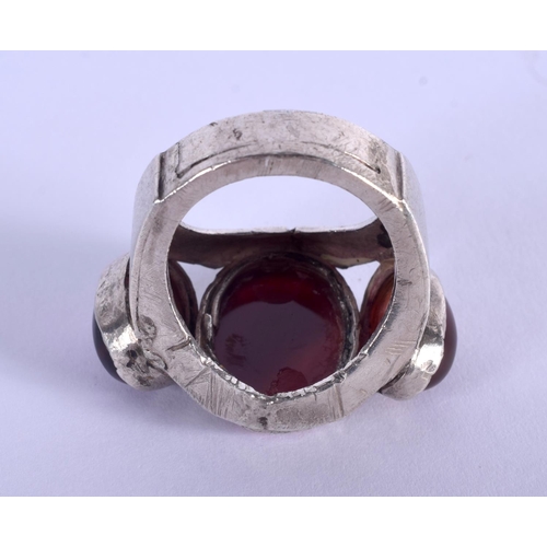 854 - A VINTAGE MIDDLE EASTERN SILVER AND AGATE KUFIC SCRIPT RING. V/W. 21 grams.