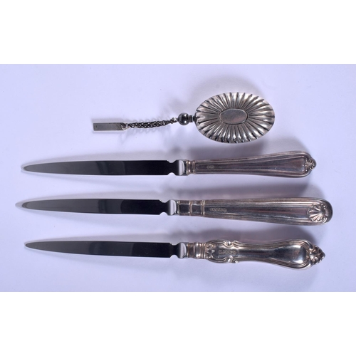 861 - THREE SILVER HANDLED PAPER KNIVES and a white metal perfume flask. Largest 18 cm long. (4)