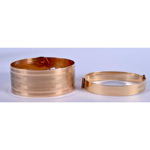 882 - TWO 9CT GOLD PLATED BANGLES. 43 grams. 6.5 cm x 5.5 cm. (2)