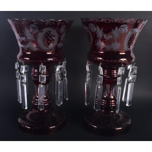 9 - A LARGE PAIR OF VINTAGE RUBY GLASS TABLE LUSTRES decorated with landscapes. 30 cm x 18 cm.