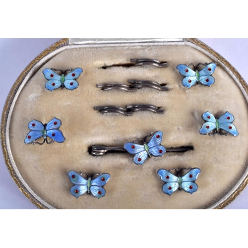 916 - A CASED ART DECO SILVER AND ENAMEL BUTTERFLY BUTTONS. (6)