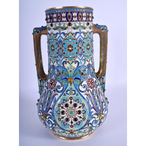 960 - A LARGE TWIN HANDLED CONTINENTAL SILVER AND ENAMEL JEWELLED VASE decorated with flowers. 1222 grams.... 