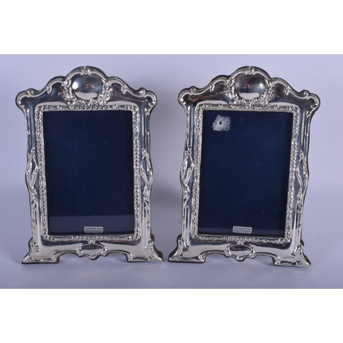 970 - A PAIR OF 1970S ENGLISH SILVER PHOTOGRAPH FRAMES. 22 cm x 16 cm.