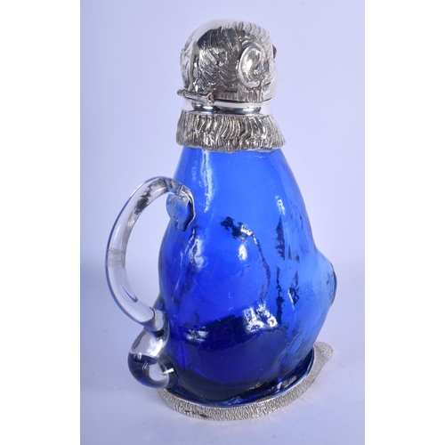 982 - A CONTEMPORARY SILVER PLATED BLUE GLASS MONKEY CLARET JUG. 21 cm high.