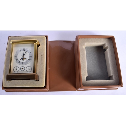 1477 - A BOXED MATTHEW NORMAN MOONPHASE REPEATING CARRIAGE CLOCK with three subsidiary dials. 17.5 cm high ... 