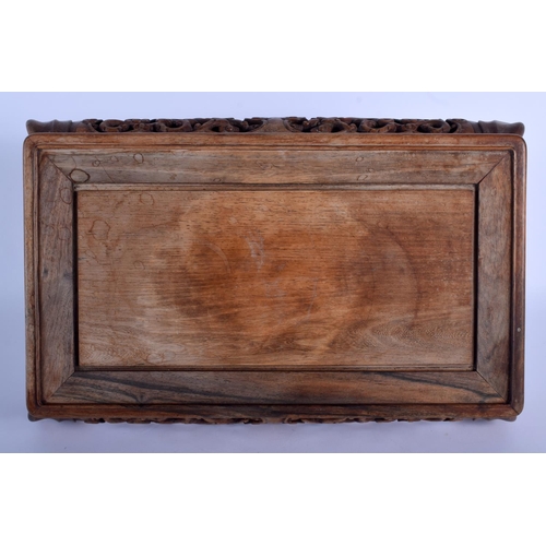 1515 - A 19TH CENTURY CHINESE CARVED HARDWOOD RECTANGULAR STAND Qing, possibly Huanghuali, decorated with l... 
