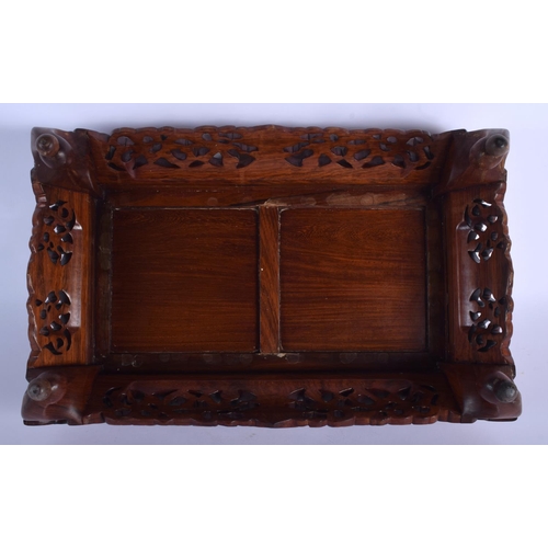 1515 - A 19TH CENTURY CHINESE CARVED HARDWOOD RECTANGULAR STAND Qing, possibly Huanghuali, decorated with l... 
