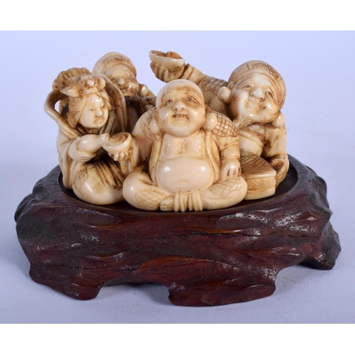 1532 - A 19TH CENTURY JAPANESE MEIJI PERIOD CARVED IVORY FIGURE OF BUDDHAS modelled in various pursuits. Iv... 