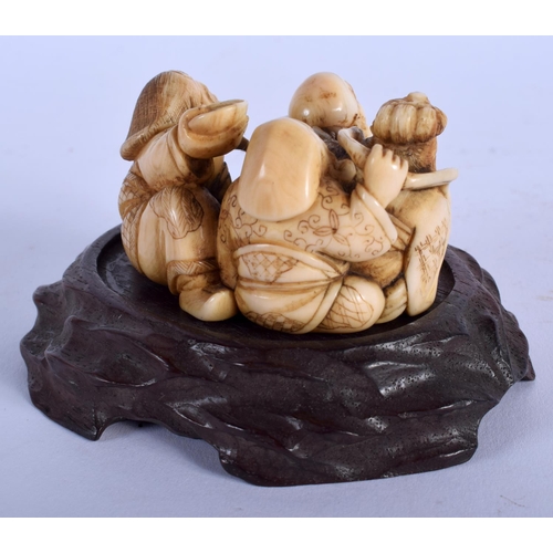 1532 - A 19TH CENTURY JAPANESE MEIJI PERIOD CARVED IVORY FIGURE OF BUDDHAS modelled in various pursuits. Iv... 