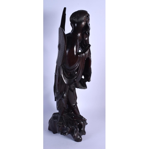 1542 - A VERY LARGE 19TH CENTURY CHINESE CARVED HARDWOOD FIGURE OF A FISHERMAN Qing, modelled holding a fis... 