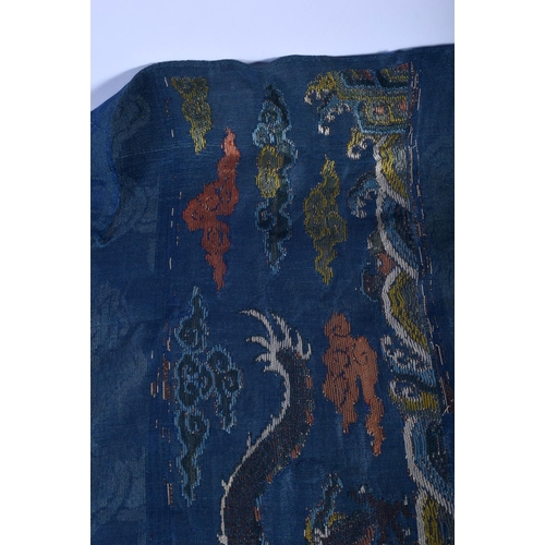 1544 - A RARE PAIR OF 17TH/18TH CENTURY CHINESE BLUE SILK WORK DRAGON PANEL Ming/Qing, modelled amongst clo... 