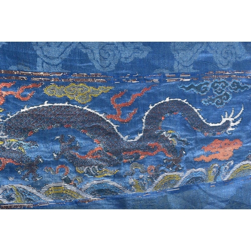 1544 - A RARE PAIR OF 17TH/18TH CENTURY CHINESE BLUE SILK WORK DRAGON PANEL Ming/Qing, modelled amongst clo... 