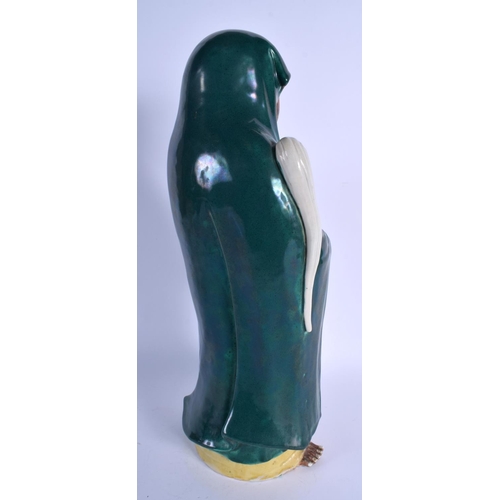 1546 - A LARGE 19TH CENTURY JAPANESE MEIJI PERIOD GREEN GLAZED STONEWARE FIGURE modelled holding a swish. 4... 