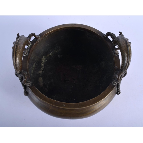 1557 - A RARE 18TH CENTURY CHINESE TWIN HANDLED BRONZE CENSER Qing, bearing elaborate seal mark to base, wi... 