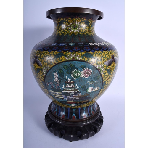 1582 - A LARGE LATE 19TH CENTURY CHINESE CLOISONNE ENAMEL BALUSTER VASE decorated with foliage and vines. C... 