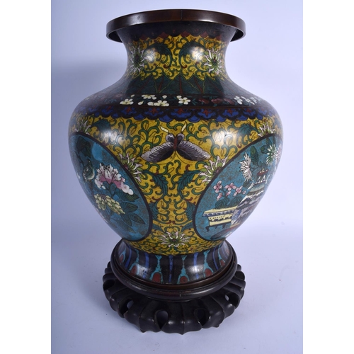 1582 - A LARGE LATE 19TH CENTURY CHINESE CLOISONNE ENAMEL BALUSTER VASE decorated with foliage and vines. C... 