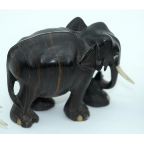 2528 - A Collection of African wooden Elephants and a page turner 13cm (6).