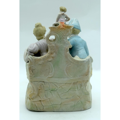 2559 - A large European Bisque figural group depicting cupid and a man and woman.31 x 21cm.