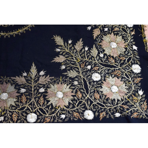 2562 - A large metal thread wall hanging decorated with a floral pattern 124 x 120cm .