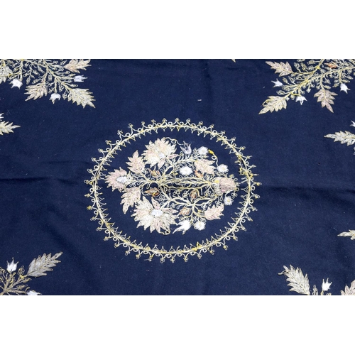 2562 - A large metal thread wall hanging decorated with a floral pattern 124 x 120cm .